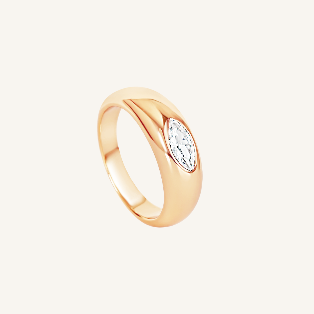 rose gold ring inspired by the Louvre's architecture with Marquise cut white cubic zirconia bezel set on white background