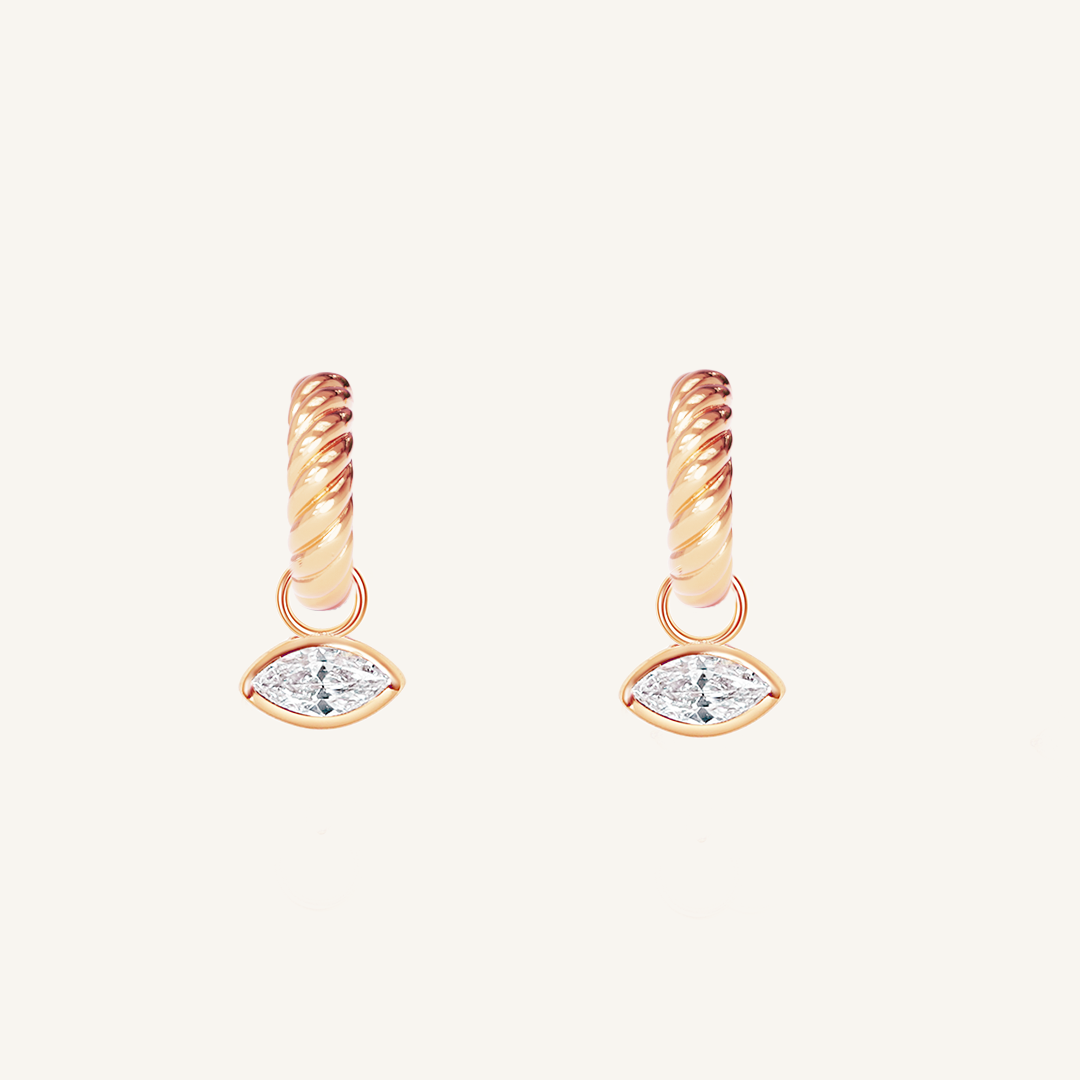 rose gold hoops inspired by the Louvre's architecture with Marquise cut white cubic zirconias bezel set hoop charms on white background