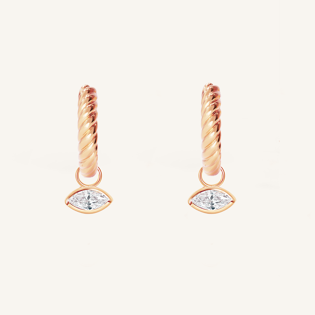 rose gold hoops inspired by the Louvre's architecture with Marquise cut white cubic zirconias bezel set hoop charms on white background