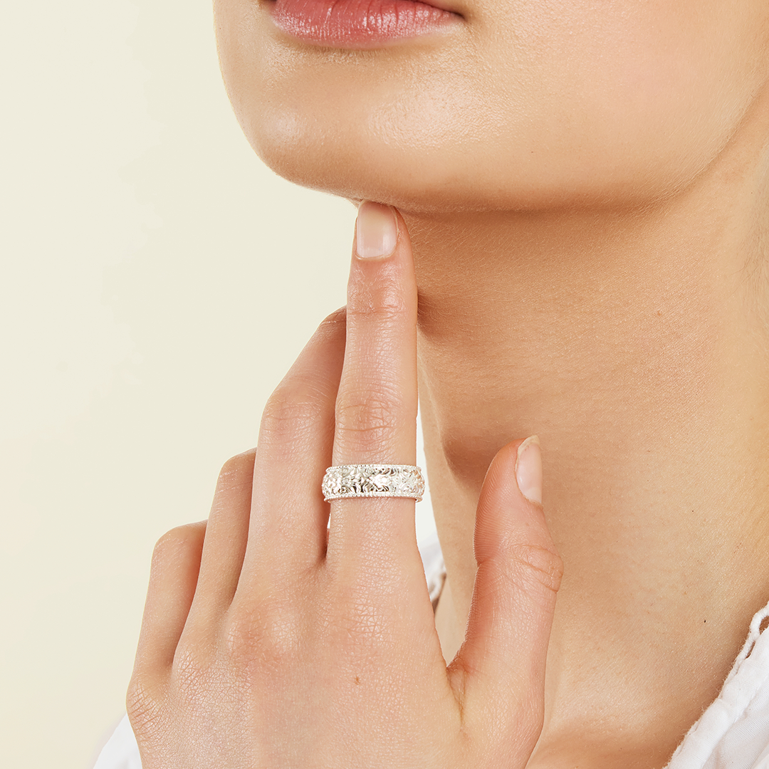 intricately designed statement silver ring inspired by Paris on finger

