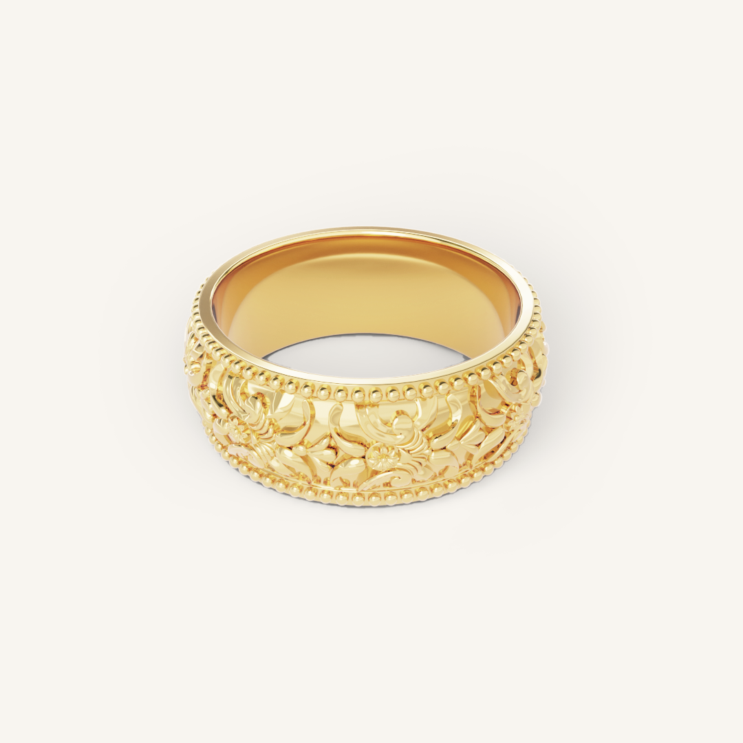 intricately designed statement gold ring inspired by Paris on white background