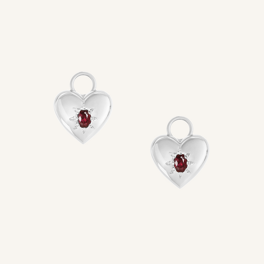 silver hoop charms with heart charms with deep red oval cubic zirconias on white background