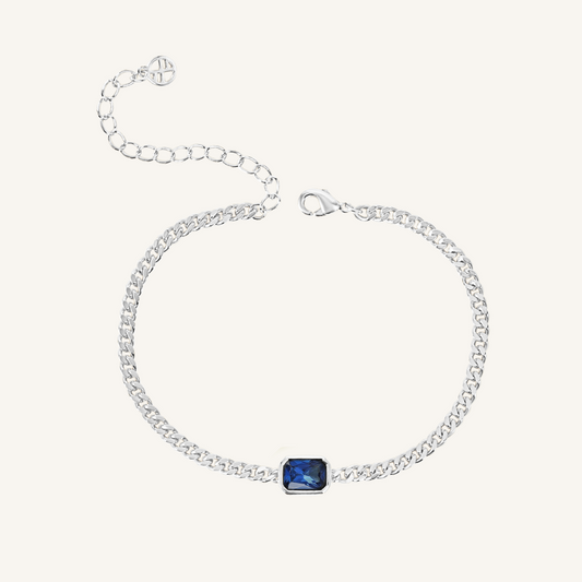 silver chain bracelet with Navy blue cubic zirconia bezel set in centre Inspired by the halls of Versailles on white background