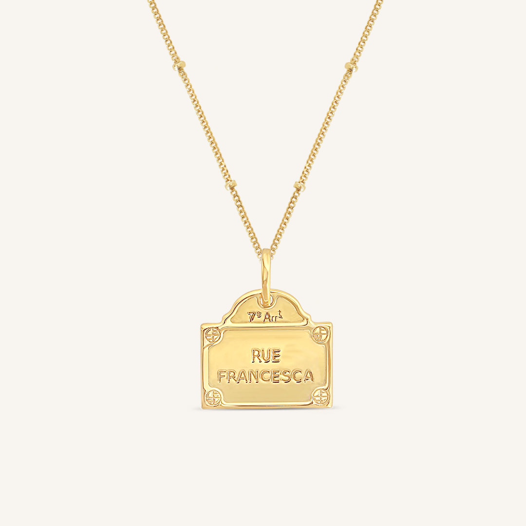 gold charm Inspired by the street signs in Paris on bobble chain on white background