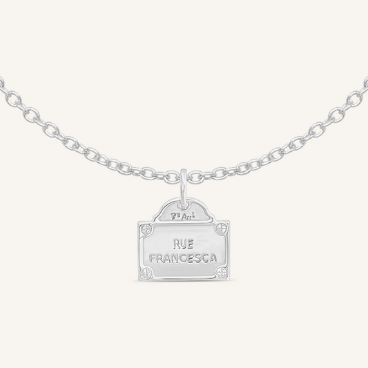 silver charm Inspired by the street signs in Paris on plain chain on white background