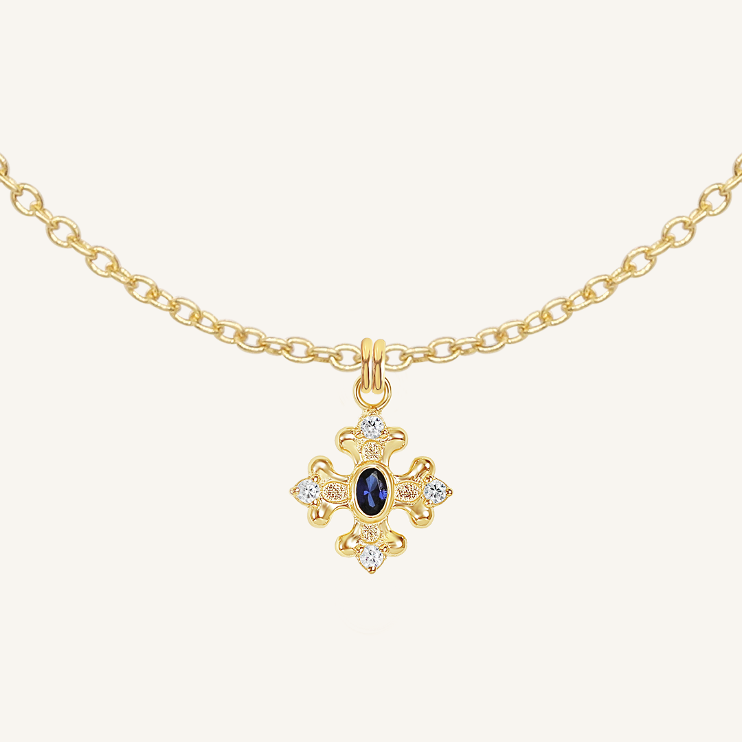 features the intricate fleur-de-lis details found in the iconic Palace of Versailles accompanied by the deep blue stone on plain chain on white background