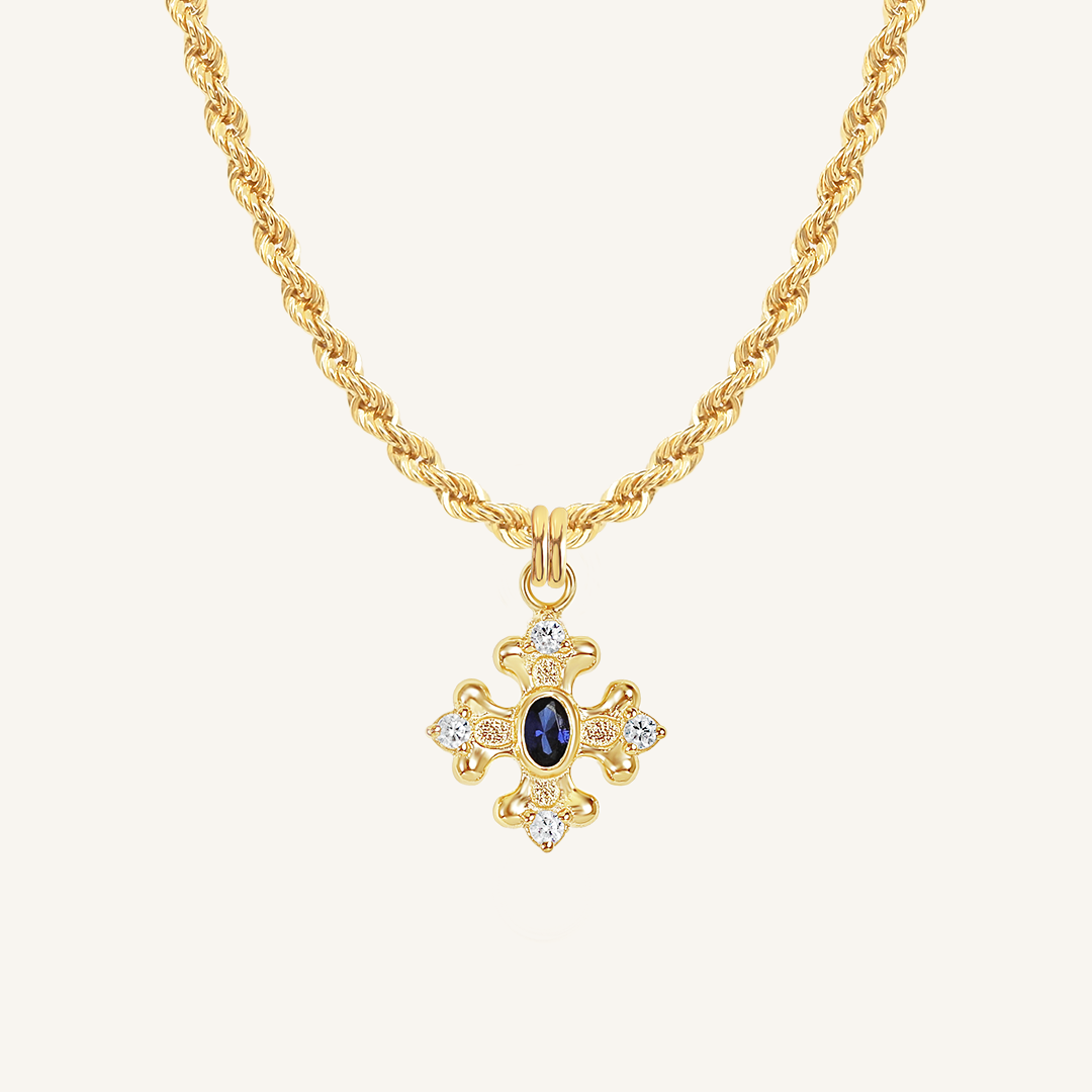 features the intricate fleur-de-lis details found in the iconic Palace of Versailles accompanied by the deep blue stone on rope chain on white background