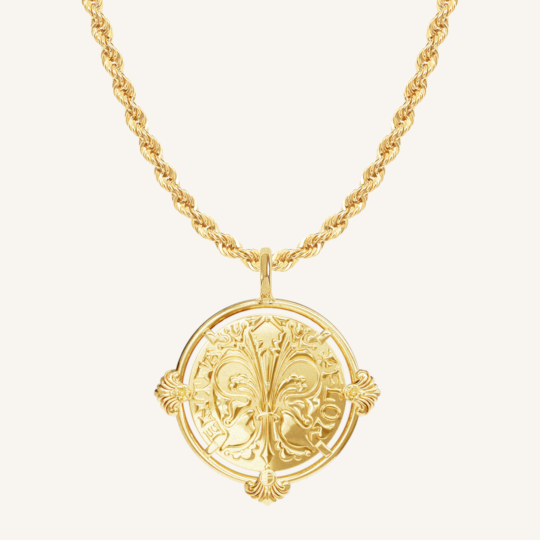 gold pendant featuring intricate patterns inspired by Palace of Versailles on gold rope chain a plain background
