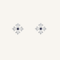 silver studs that features the intricate fleur-de-lis details found in the iconic Palace of Versailles accompanied by the deep blue stone on white background