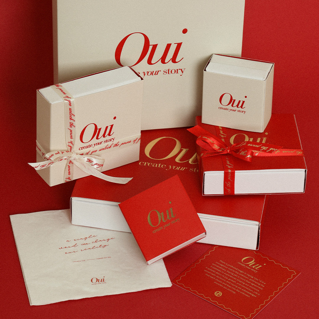 Red, white and gold gift wrapping with red and white ribbon on a red background inspired by Paris and the world Oui 