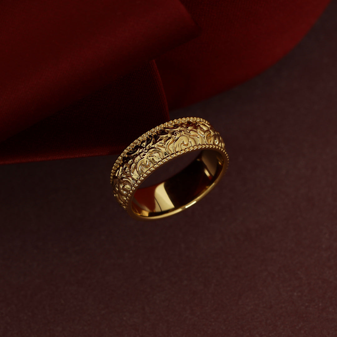 intricately designed statement gold ring inspired by Paris on red background